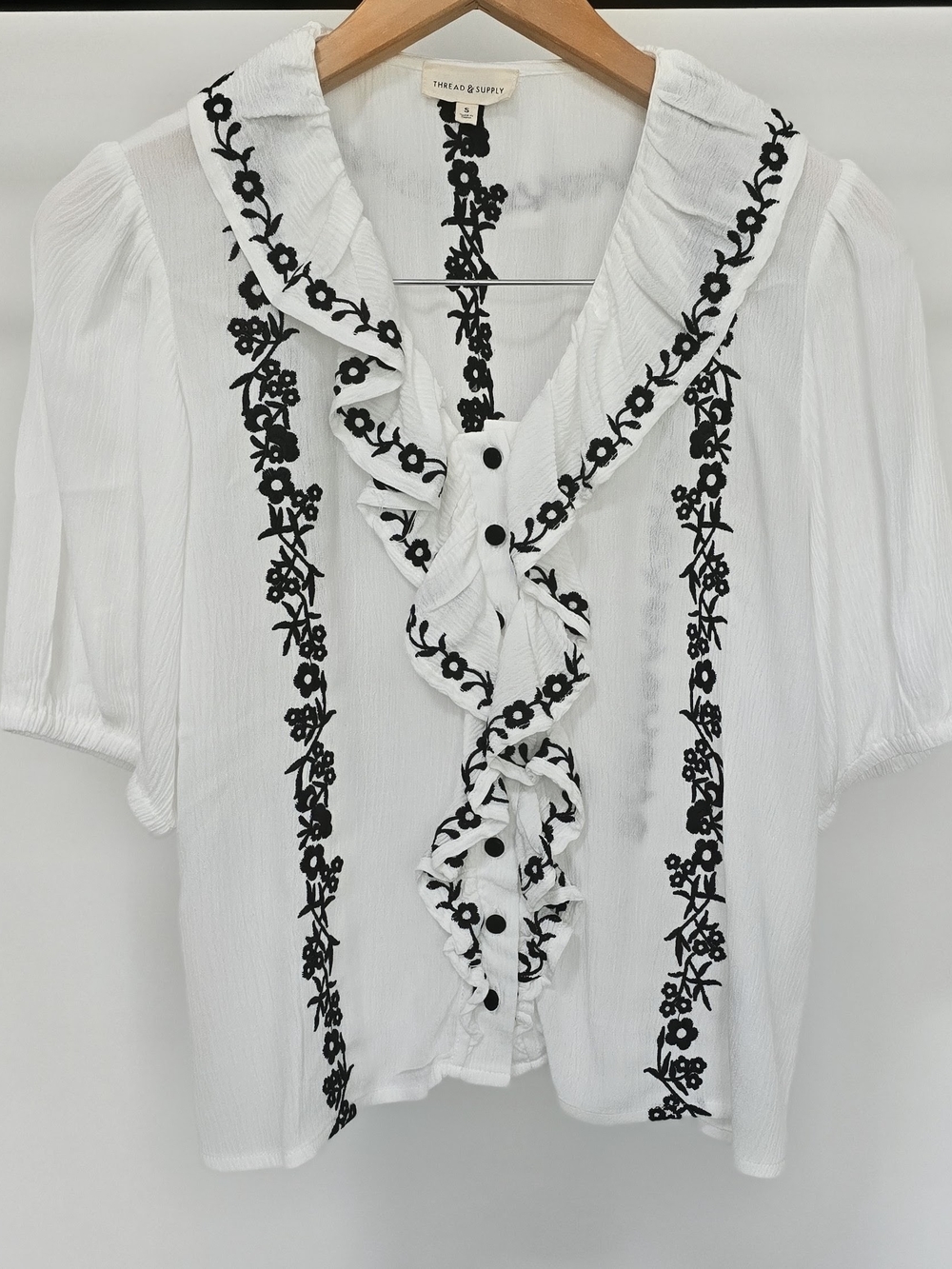 Thread & Supply White Short-Sleeve Ruffle Blouse with Black Floral Trim